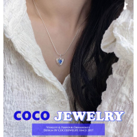 เครื่องประดับ COCOJEWELRY 925เงินสเตอร์ลิงการออกแบบระดับไฮเอนด์ที่มีอารมณ์สร้อยคอรักสีฟ้าสร้อยคอลูกศรไขว้ทันสมัย