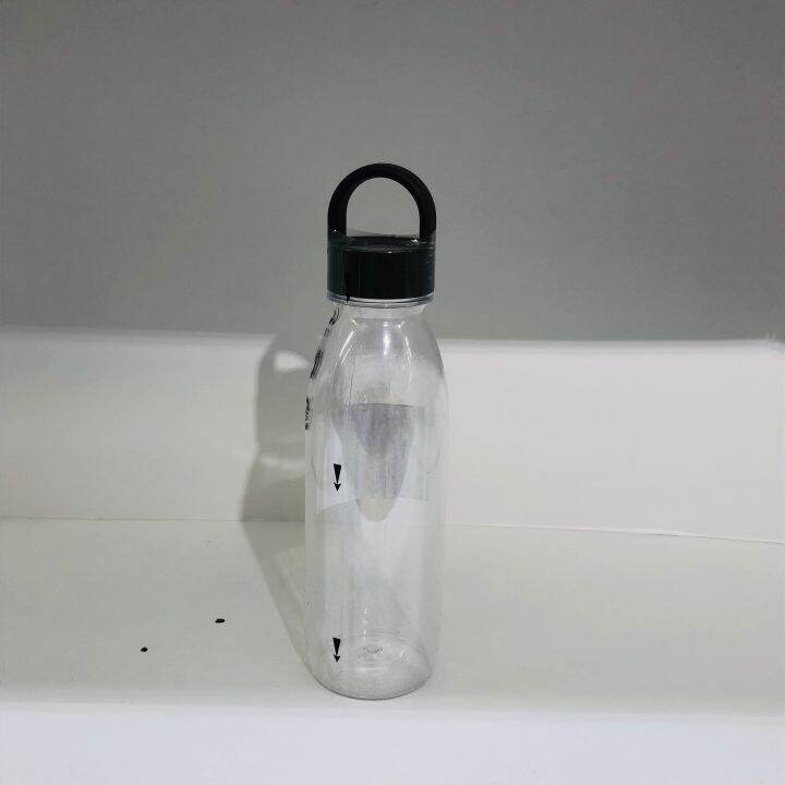 IKEA IKEA 365+ transparent water bottle with a glass of fruit juice