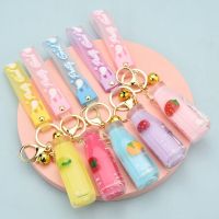 【hot】 cute acrylic fruit milk bottle keychain car bag quicksand into oil liquid pendant