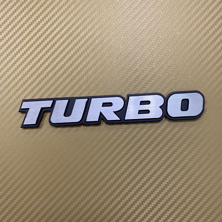 โลโก้* TURBO  สีเงินขอบดำ งานอลูมิเนียม ขนาด* 2.5 x 16 cm ราคาต่อชิ้น
