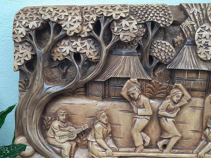 DANCING THE TINIKLING. THE NATIONAL DANCE OF THE FILIPINOS CARVED IN 2