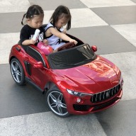 Ô tô xe điện trẻ em KUPAI 2021 cho bé 2 chỗ 4 động cơ tự lái và điều khiển (Đỏ-Trắng-Cam) thumbnail
