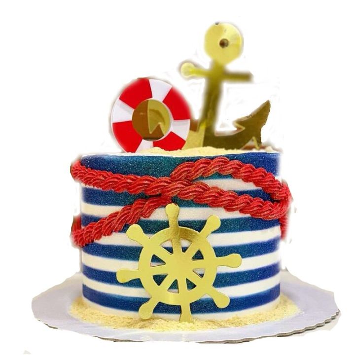 Premium Photo | Marine cake decorated with fondant anchor on the top.