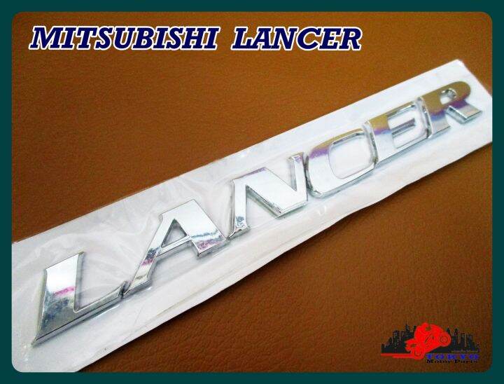 mitsubishi-logo-lancer-plate-sticker-chrome-size-18x2-cm-1-set-โลโก้-lancer-ติด-mitsubishi-ขนาด-18x2-ซม-พร้อมกาวติด