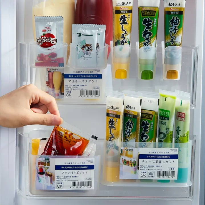 Sauce packets receive a case refrigerator door hanging mustard sauce