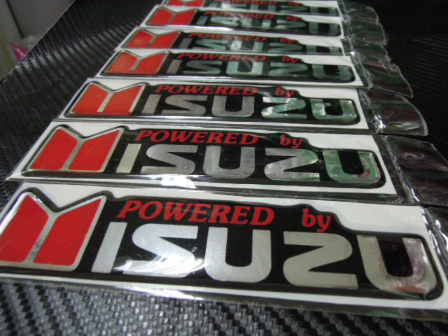 สติ๊กเกอร์เทเรซิ่นนูนอย่างดี-คำว่า-powered-by-isuzu-dmax-by-isuzu-d-max-ติดรถ-แต่งรถ-อีซูชุ-sticker