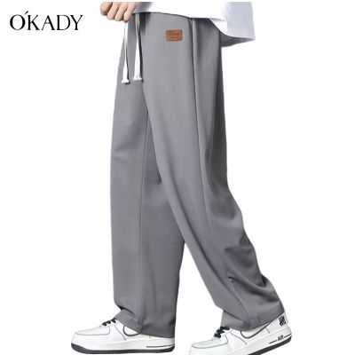 ∋ 2011 OKADY กางเกงขากว้างผู้ชายแฟชั่นลำลองสีทึบหลวมตรงกางเกงอินเทรนด์แบรนด์ผ้าระบายอากาศคุณภาพสูง