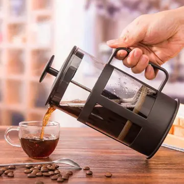 Charcoal filter outlet for coffee maker