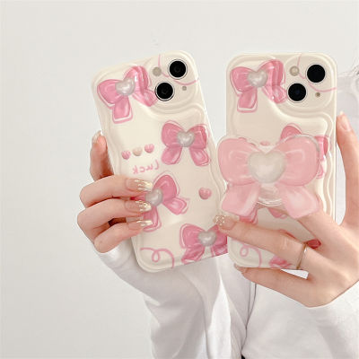 กรณีโทรศัพท์รักโบว์วัยรุ่นสำหรับ iPhone 12 เคสโทรศัพท์สีชมพู 3D Bowknot Holder สำหรับ iPhone 11ProMax เคสโทรศัพท์แบบคลื่นสำหรับ iPhone XR เคสโทรศัพท์สไตล์เกาหลีสำหรับ Phone13 เคสโทรศัพท์สีชมพูน่ารักสำหรับ iPhone Xs