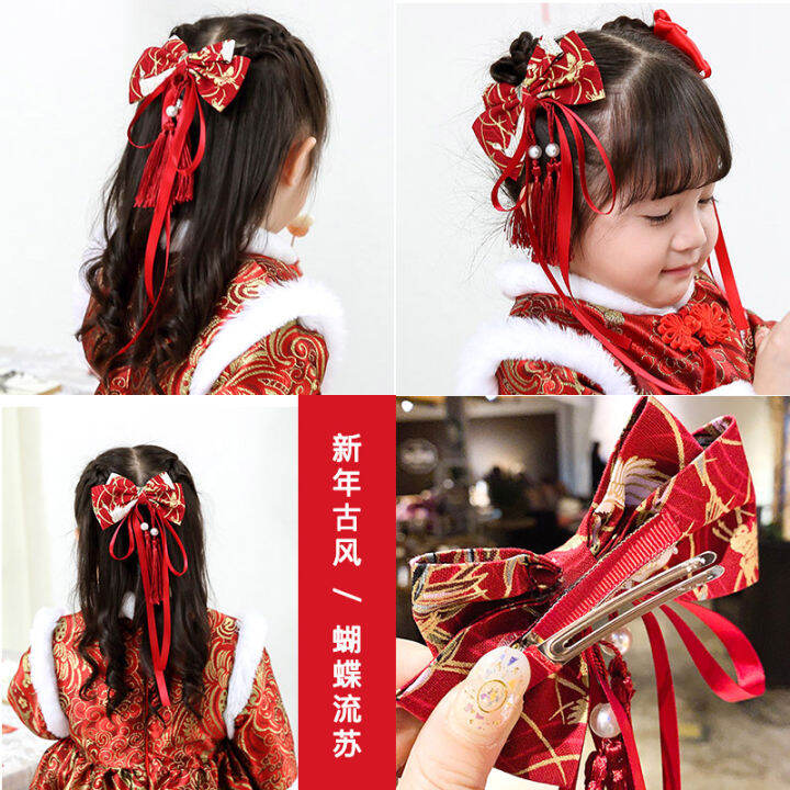 Cute asian kid girl in Traditional Chinese dress with holding sacred Orange  at chinese temple in bangkok thailand. Stock Photo by ©civic_dm@hotmail.com  153200488