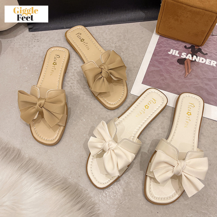 white cloth flip flops