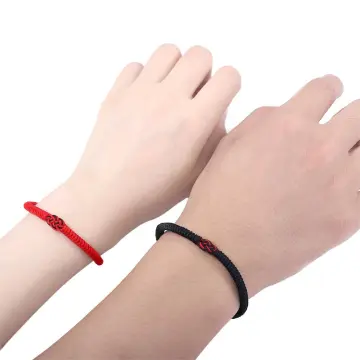 Red rope on on sale wrist