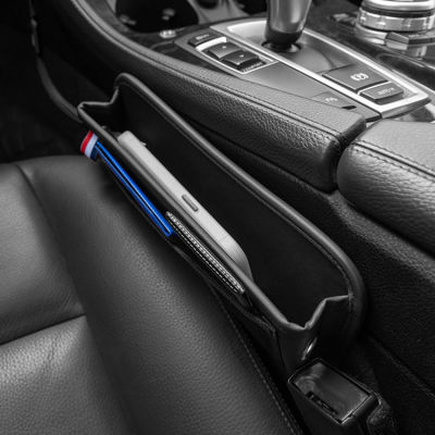 ช่องว่างระหว่างเบาะรถยนต์กระเป๋าเก็บของ Nappa ช่องเก็บของควบคุมกลางเบาะรถยนต์หนังสำหรับเก็บชิ้นส่วนภายในรถยนต์เก็บของ