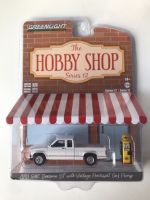 Greenlight 1/64 The Hobby Shop Series 12 - 1991 GMC Sonoma ST with Vintage Pennzoil Gas Pump 97120-D