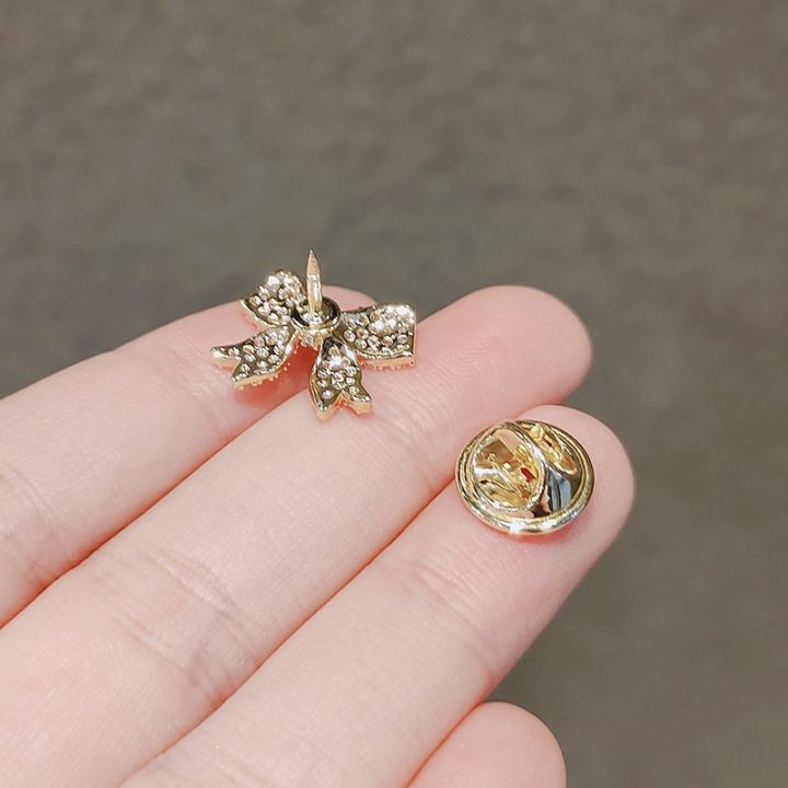 fashion-cute-bowknot-brooches-for-women-metal-anti-glare-lapel-pin-fixed-clothes-pins-sweater-coat-clothing-accessories-brooch