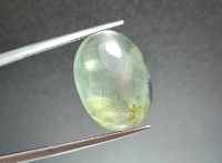 พลอยหลังเบี้ย ไหมเขียว (Green Rutilated Quartz)  น้ำหนัก 13.74 ct. ขนาด 13*6.6*17.9 mm. พลอยแท้ 100% เนื้อดี ราคาถูก