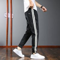 The new 2022 male chun xia thin elastic waist basketball tooling sweatpants male loose bundle feet nine points leisure trousers