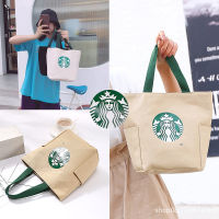 กระเป๋าผ้า กระเป๋าถือ Starbucks ลดโลกร้อน กระเป๋าstarbucks กระเป๋าดีไซน์สวย  ราคาพิเศษ ผลิตจากผ้า Canvas เนื้อผ้าหนา ดีไซน์สวย ทรงสีเหลี่ยมสวยงาม ใส่สินค้าได้เยอะ สำหรับสาวๆ ที่ชอบสินค้า starbucks