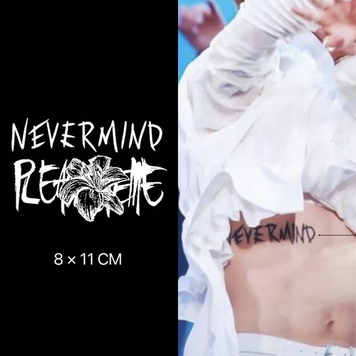 Nevermind lettering tattoo on the shoulder