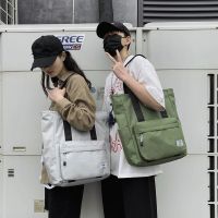 Single shoulder bag men canvas bag contracted handbag Japanese large capacity lazy student female le单肩包男帆布包简约手提包日系大容量慵懒风学生女休闲潮牌邮差包