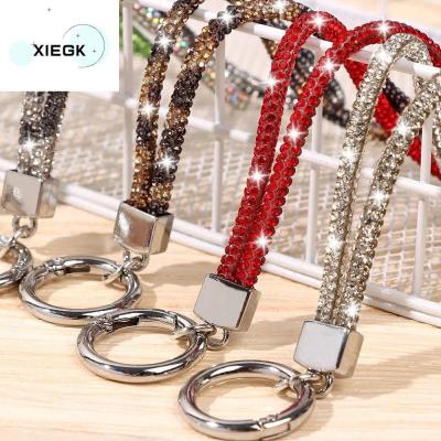 XIEGK พลอยเทียมเทียม สายคล้องโทรศัพท์ไรน์สโตน Bling Bling แวววาวสดใส สายคล้องคอคริสตัล หรูหราสุดหรู เพชรประดับเพชร สายคล้องโทรศัพท์เพชร เครื่องประดับโทรศัพท์