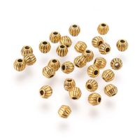 200pc Tibetan Style Alloy Spacer Beads Lead Free Cadmium Free Bicone Antique Golden Color Size: about 4mm long 4.5mm wide hole: 1mm.