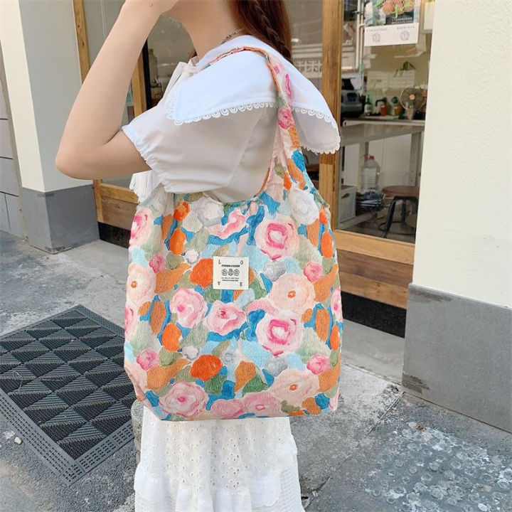 bangkokshop-b905-กระเป๋าผ้าลื่น-ผ้านิ่ม-สีพื้นลายดอกไม้