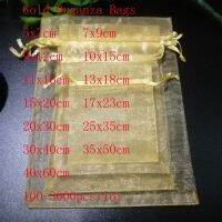 ขายส่ง 100pcs / lot ทอง Organza เครื่องประดับกระเป๋า drawstring ถุงของขวัญบรรจุภัณฑ์ถุงแต่งงานคริสต์มาสและกระเป๋าขนาดเล็ก