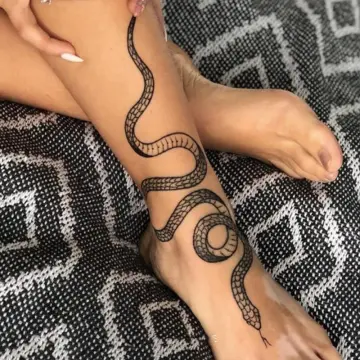 Red snake tattoo on the forearm