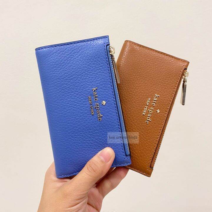 Comparison of Kate Spade's small Leila wallet and the Coach small