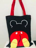 กระเป๋าสะพายไหล่ ผ้าแคนวาส (ลดโลกร้อน) ลาย มิคกี้ เม้าส์  ตัว  body   mickey mouse  ดำแดง  มีตีนตุ็กแก ใส่แฟ้ม a4 ได้  ขนาด 40x30 cm  สวยงาม  NPNN SHOP