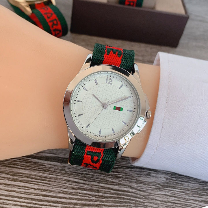 ข้ามพรมแดนสีเขียวสีแดงสีเขียวนาฬิกาสายไนลอนสายนาฬิกาผู้ชายลำลองนาฬิกาผู้หญิงผู้ผลิตขายส่ง