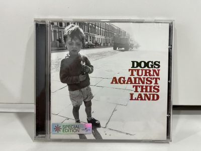 1 CD MUSIC ซีดีเพลงสากล     DOGS TURN AGAINST THIS LAND   (A16F1)