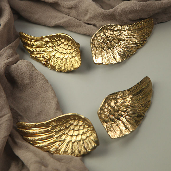 การออกแบบทองเหลืองปีกทองจับถังตู้เฟอร์นิเจอร์ลิ้นชักบุคลิกภาพทองขนาดเล็กจับครัวจับมือจับประตู