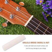 กระดูก Ukulele Bridge Saddle และ Nut สำหรับชิ้นส่วนซ่อมเครื่องดนตรี Ukuleles 4 สาย