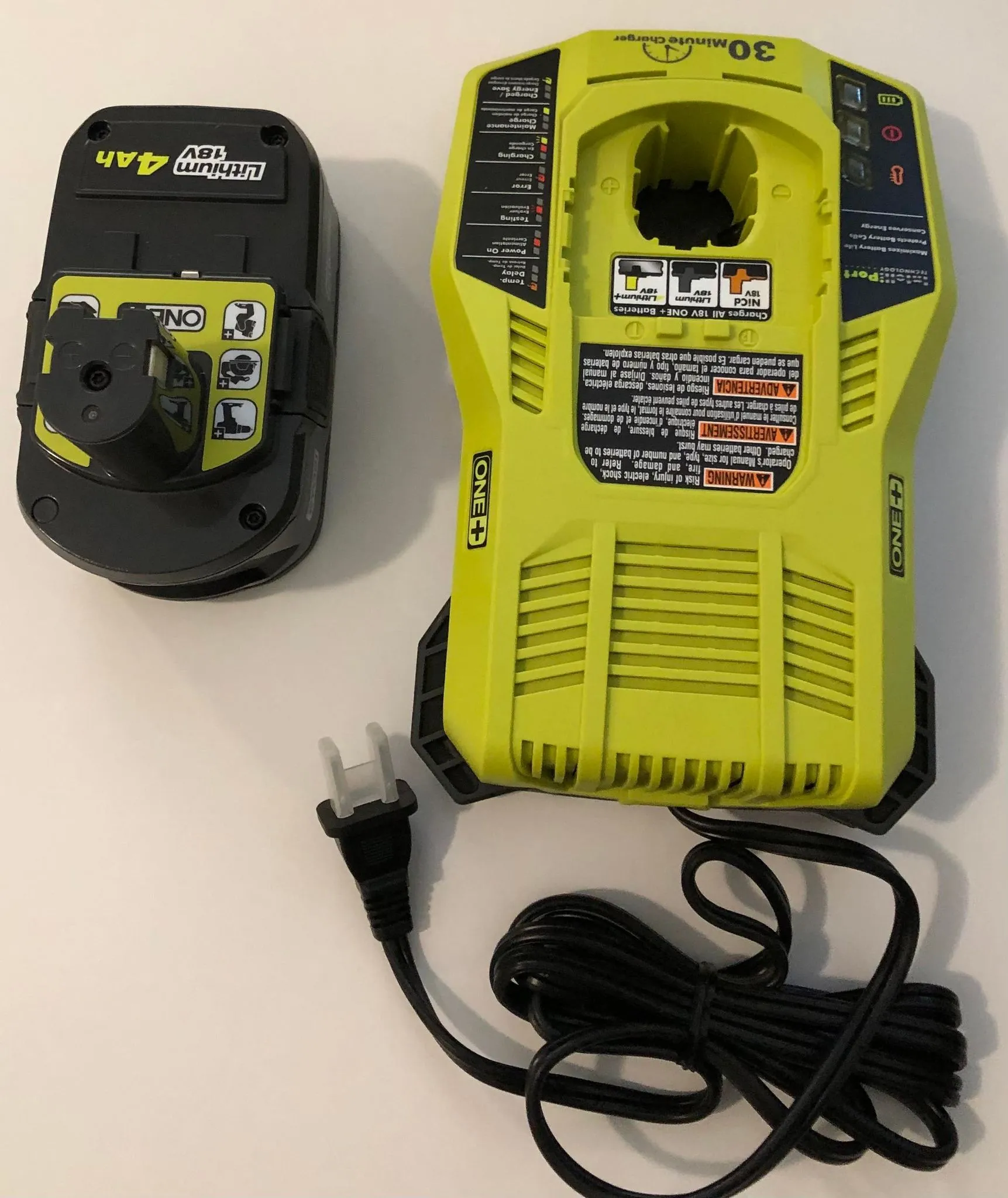 Ryobi 18V  Lithium Ion Battery PBP005 and P117 Dual Chemistry Lithium  Ion and NiCad Battery 220v Charger. This item does not come with original  box since they were taken from set.