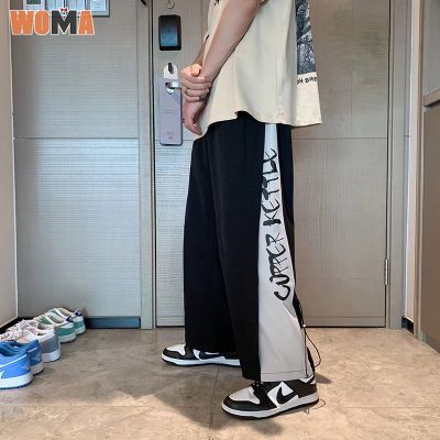 WOMA ตัวอักษร Paneled กางเกงทรงหลวมผู้ชายเวอร์ชั่นเกาหลีเทรนด์ตรงกางเกงขากว้างหลวม High Street Ruffian หล่อกางเกงขายาวอเนกประสงค์ผู้ชาย