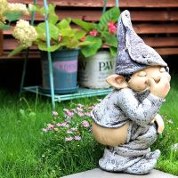 geegostudio Add a Touch of Whimsy to Your Garden with this Adorable Naughty Knome Statue!