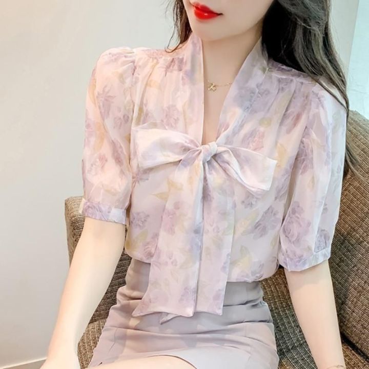 เสื้อผู้หญิง2022ฤดูร้อนใหม่โบว์ดอกไม้เสื้อผู้หญิงสไตล์เกาหลีแฟชั่นหลวมชีฟองแขนสั้นด้านบน