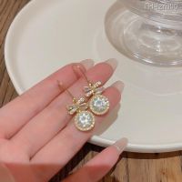 ? เครื่องประดับ 925 silver needle light luxury niche super flash set auger bowknot earrings female ins south Korean new pearl stud earrings earrings