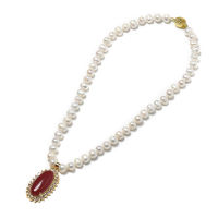 Having a saffron Oval 24*40*10 MM Pendant with golden edges and pure white pearls 8-9 MM Freshwater Natural Pearl Necklace