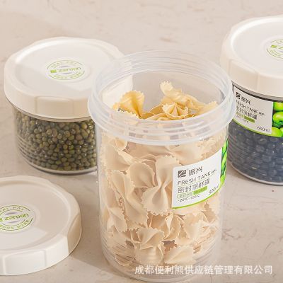 Medium transparent plastic sealed cans of milk powder cans of tea food cans of grain in the kitchen receive a case storage tank