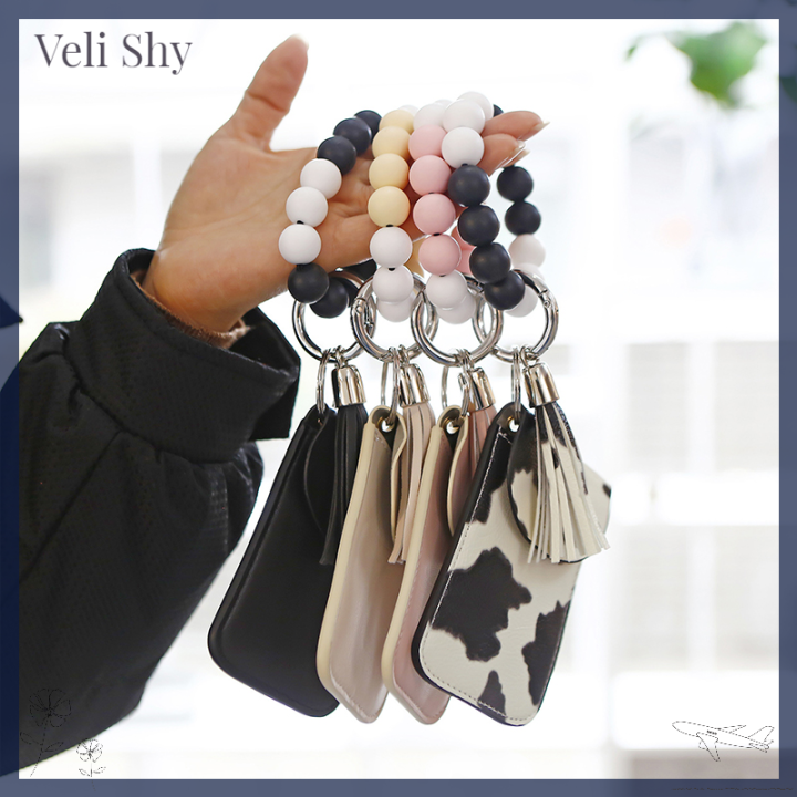 veli-shy-พวงกุญแจสร้อยข้อมือลูกปัดคล้องข้อมือซิลิโคน-เคสหนังกำไลข้อมือพู่ห้อยสำหรับกระเป๋าเก็บบัตร