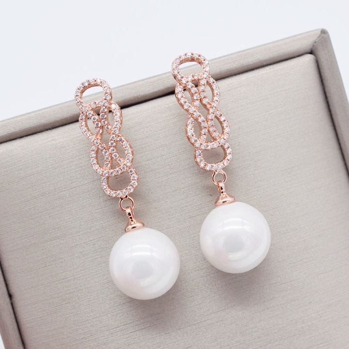 white-teardrop-sea-shell-pearl-white-golden-plated-cz-pave-earrings