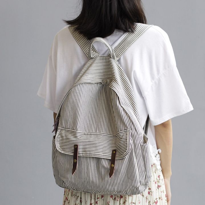 กระเป๋าหนังสือผู้หญิงสำหรับวัยรุ่นผ้าที่เดินทางมาพักผ่อนผ้าฝ้ายกระเป๋านักเรียนกระเป๋าเป้ลายทุกวัน