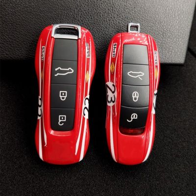 ฝาครอบป้องกันกุญแจเหมาะสำหรับ Porsche Cayenne Macan Boxster Cayman 911 9YA 971สัญญาณเตือนภัยรถยนต์เปลือกแข็งปลอกรีโมทสีแดงรีโมทเปิดประตูระยะไกล