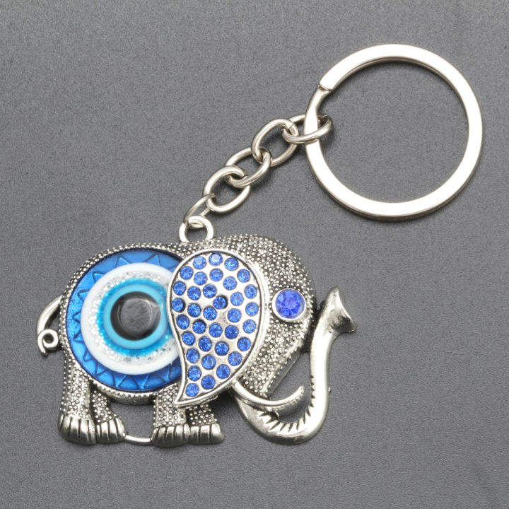 จี้กุญแจจี้รูปสัตว์พวงกุญแจดวงตาปีศาจพวงกุญแจช้างงานฝีมือของผู้ชายซงเฉิง