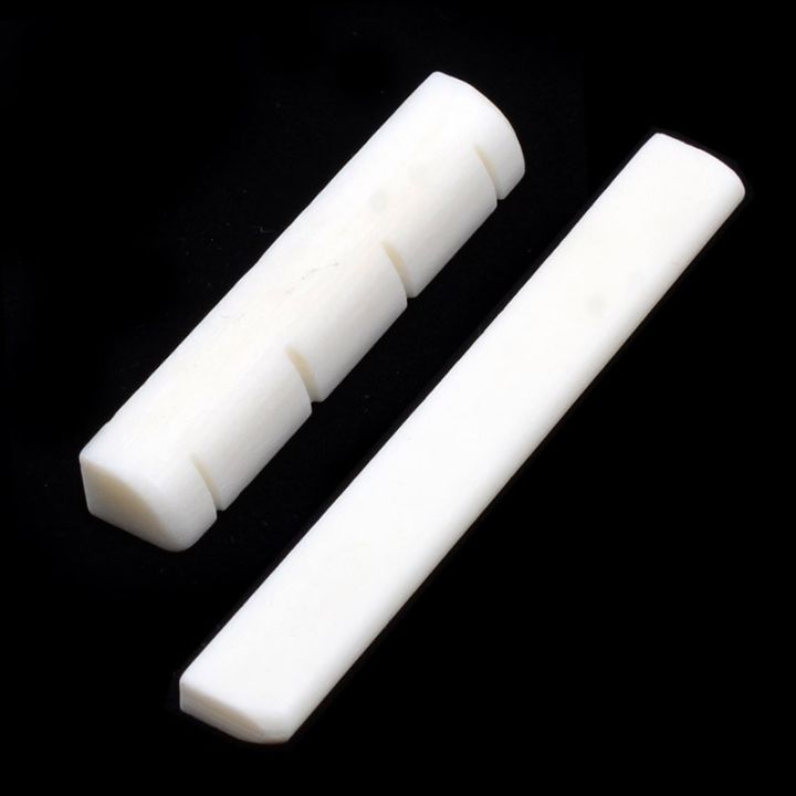 100pcs-cattle-bone-bridge-saddle-nut-slotted-for-ukulele-uke-guitar-4-stringed-instruments-accessories