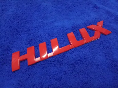 AD.โลโก้ HILUX (REVO) สีแดง 3.5×21cm 1ชิ้น