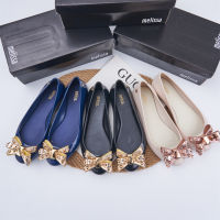 Melissa Womens Shoes with Raised Round Head Rivets and Jelly Shoes with A Bow Tie on One Foot